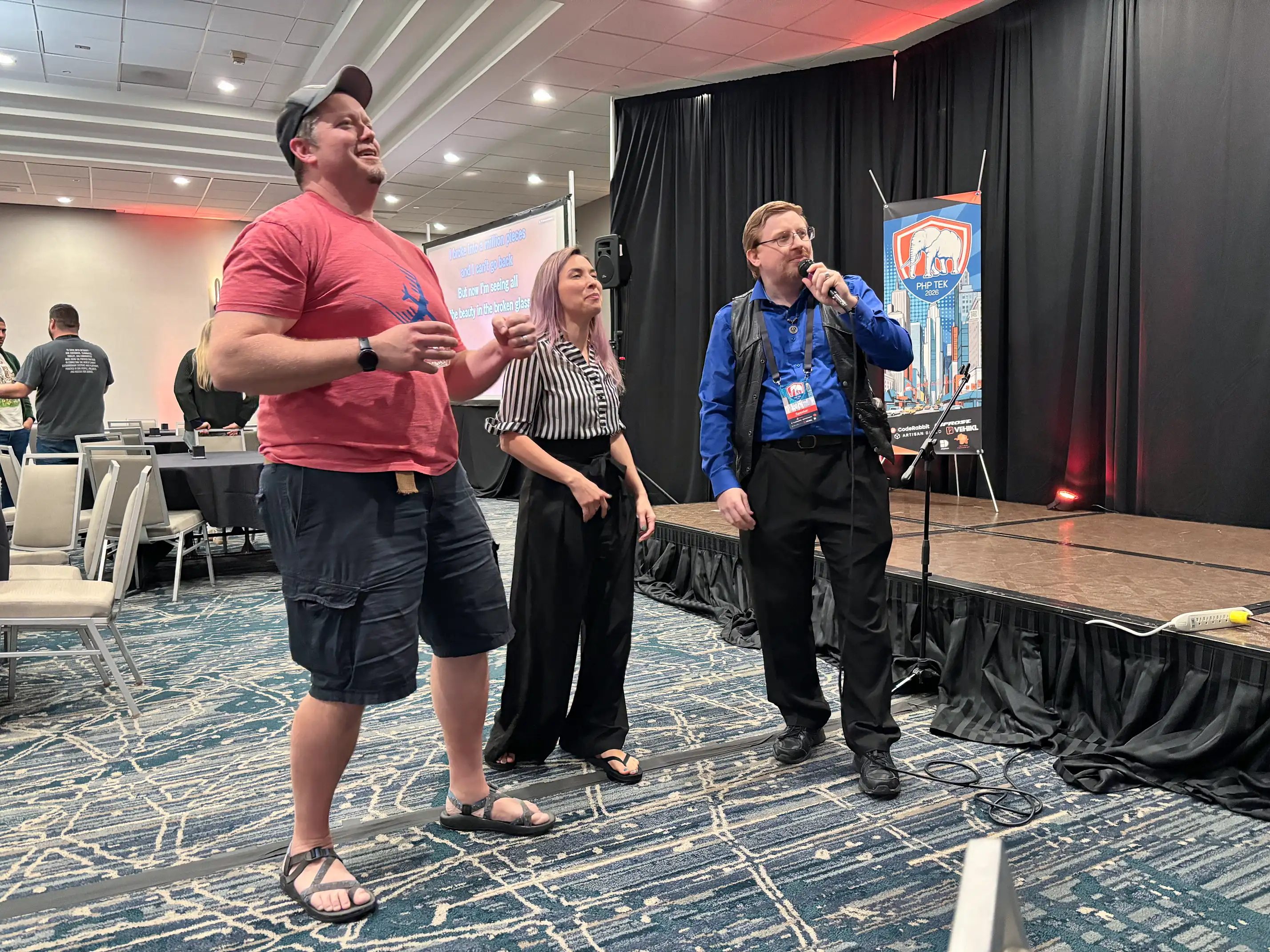 Conference attendees sing karaoke at PHP Tek
